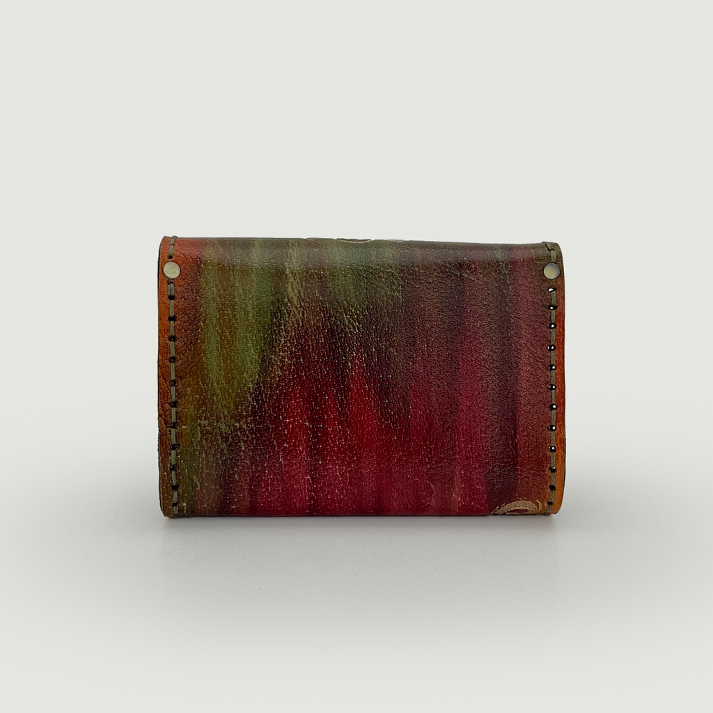 Multicolored leather wallet on a white background