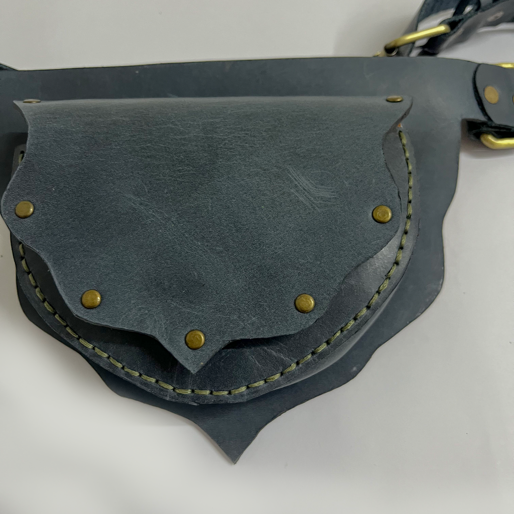 Details of navy leather waist bag